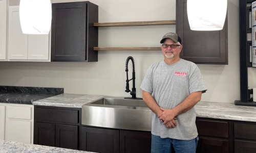 Staff member next to cabinets