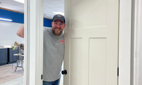 Staff member showcasing door